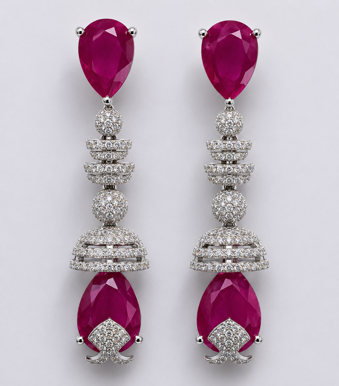Silver-tone hoop earrings with Ruby pink stones.
