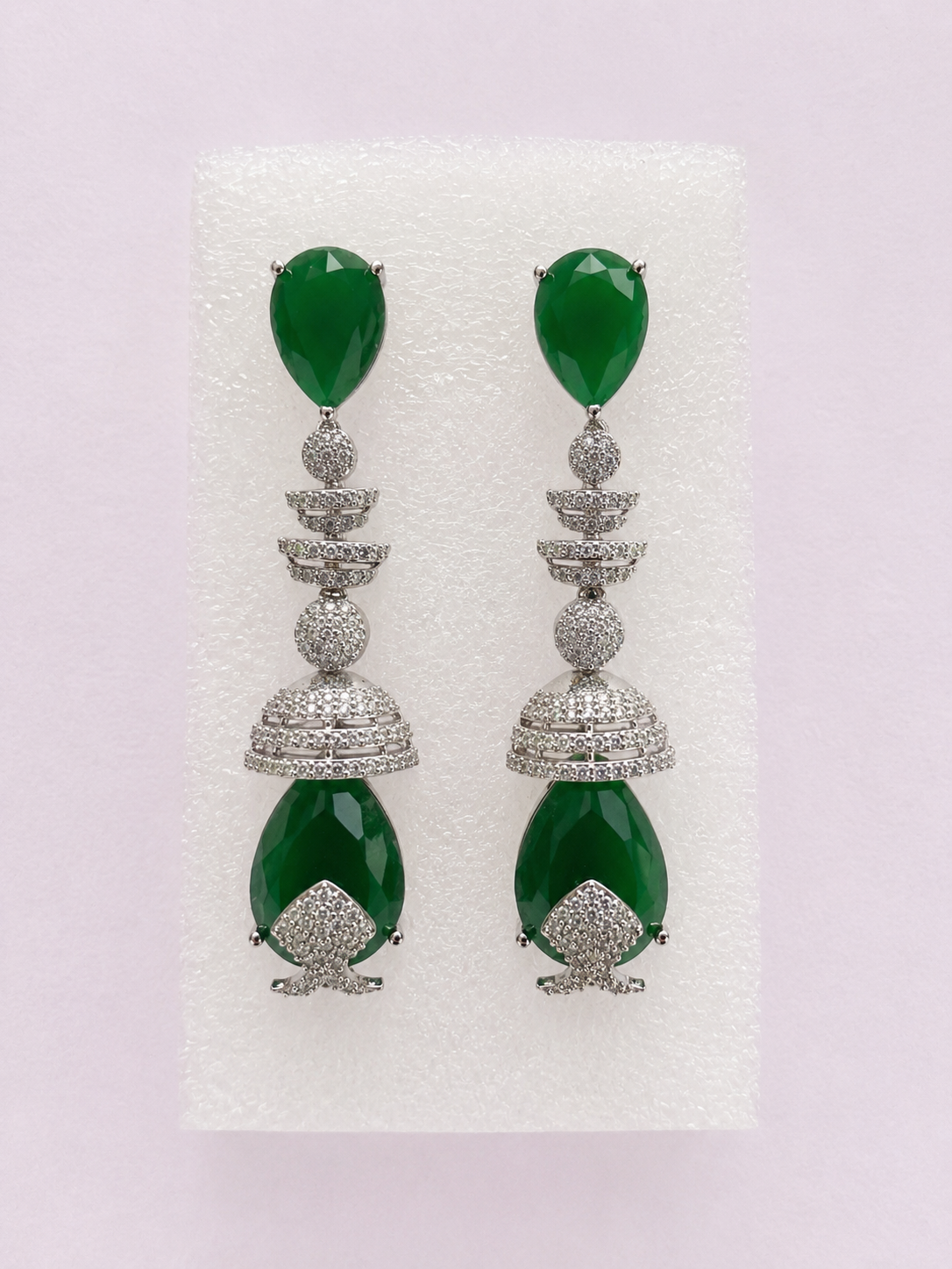 Silver-tone hoop earrings with green tones stones
