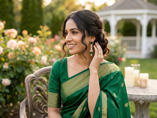 Gold-tone hoop earrings with green tones stones